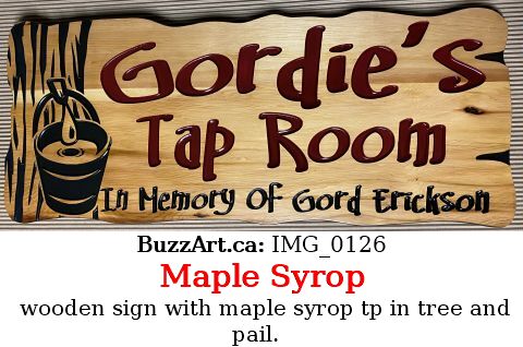 wooden sign with maple syrop tp in tree and pail.  